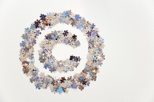 Large copyright sign made of jigsaw puzzle pieces